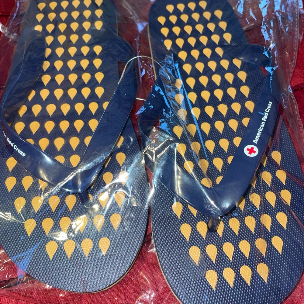 Women's Blue and Yellow flip flops size large NEW